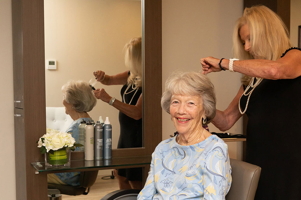 Senior woman getting her hair done