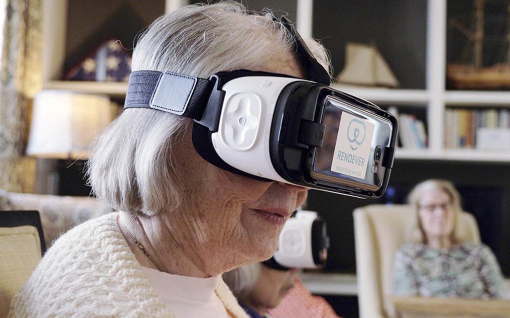 a senior woman wears a virtual reality headset