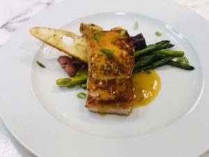 prepared meal featuring cooked salmon and asparagus
